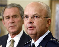 Critics say a military officer is not suited for the role of spy chief