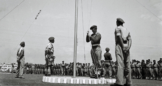 Training base of the fledgling Israeli Defence Forces raising Israeli flag