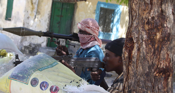 Somalia militant fighters aim guns