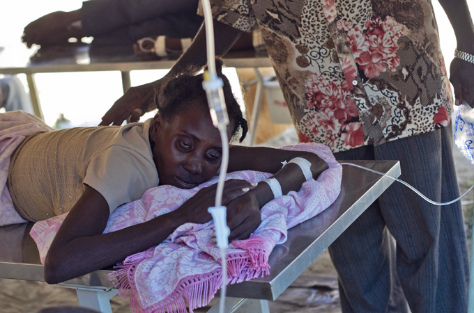 Cholera victim is administered an IV solution
