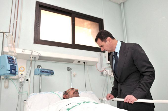 Bashar al-Assad at hospital bed