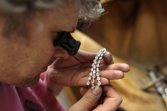 Jeweller examining earring