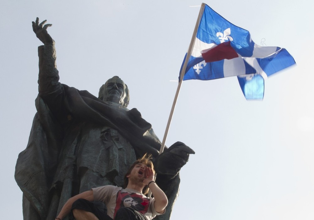 Student participates in a protest against tuition hikes in downtown Montreal