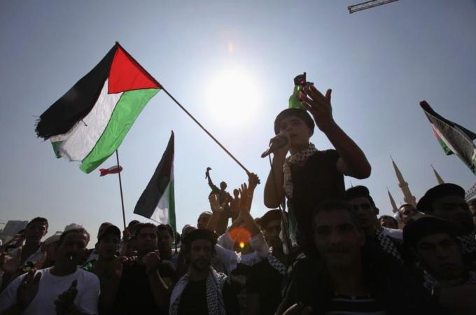 Palestinians displaced from the Nahr al-Bared refugee camp in northern Lebanon take part in a protest against the cessation of rebuilding the camp, at Martyrs'' square in Beirut