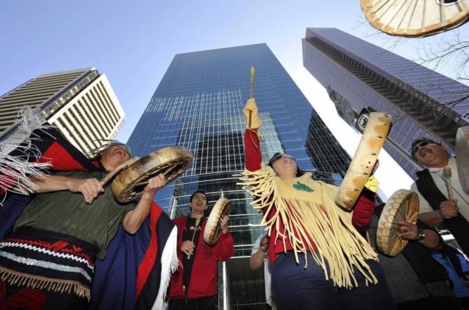 First nations natives from British Columbia protest in front of the headquarters of Enbridge before the company''s annual general meeting in Calgary.