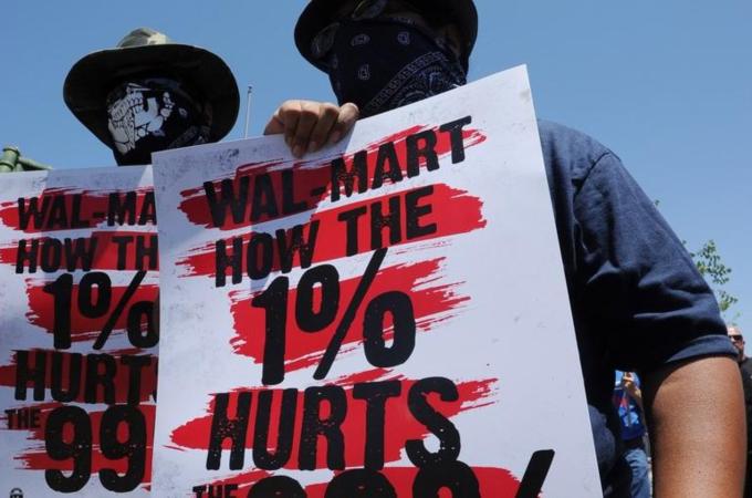 Thousands of protesters march during the