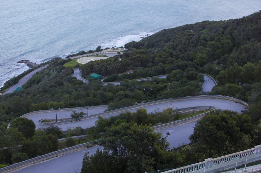 The view off the back porch of Ben Ali(***)s Sidi Bou Said Palace. The winding road leads to a helicopter landing pad on the waterfront. 