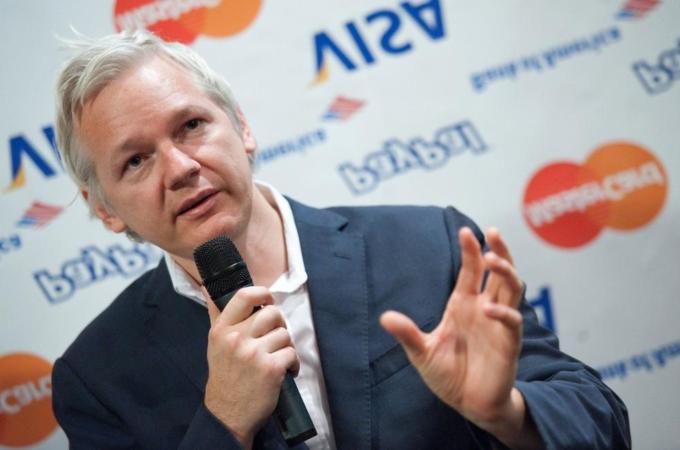 Wikileaks founder Julian Assange stands