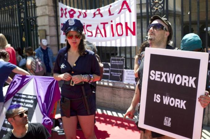 Sex workers activists attend a demonstration with prostitutes against a proposition to abolish prostitution in Lyon