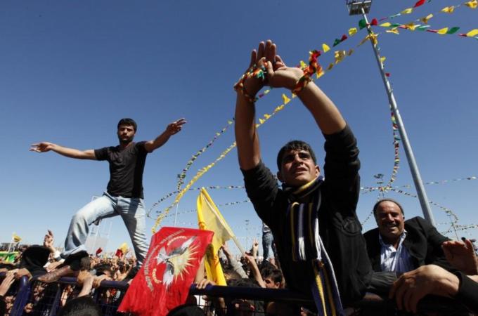 Demonstrators attend a gathering to celebrate Newroz in the southeastern Turkish city of Diyarbakir