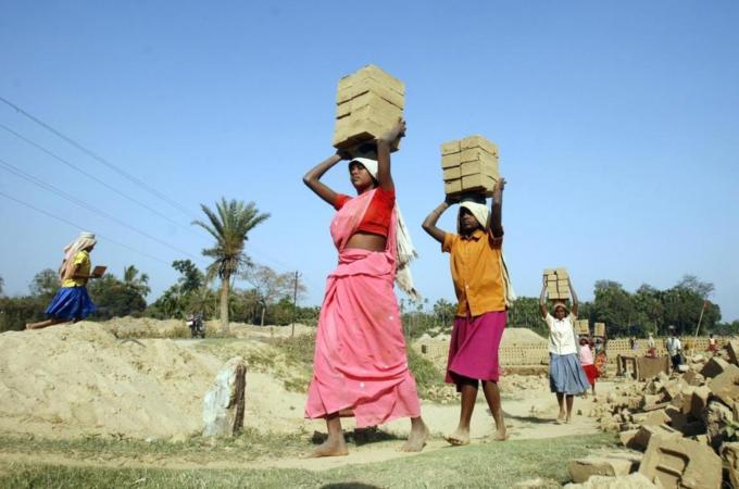 Women labourers work in a brick factory on International Women''s Day in Jirania village