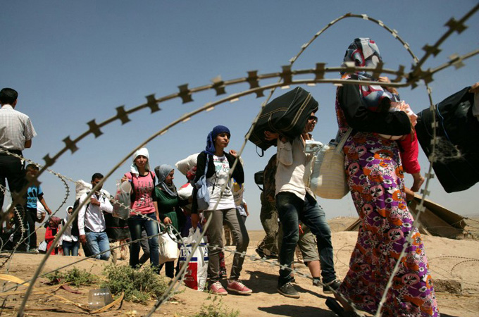 Syrian refugees flood Iraq