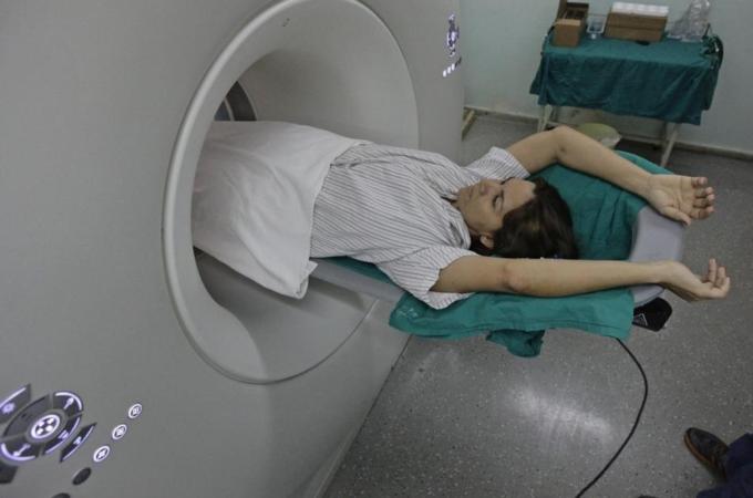 A woman lies during a scan in the tomography section of Havana''s main cardiology and heart surgery hospital