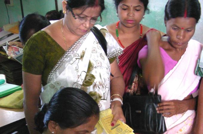 The bank has over 28,000 account holders, mostly illiterate customers [Amarjoyti Borah/ Al Jazeera]