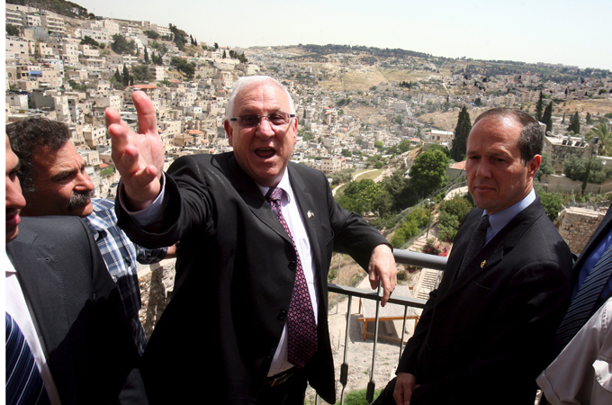 Israeli officials overlook the Arab East Jerusalem neighbourhood of Silwan [EPA]