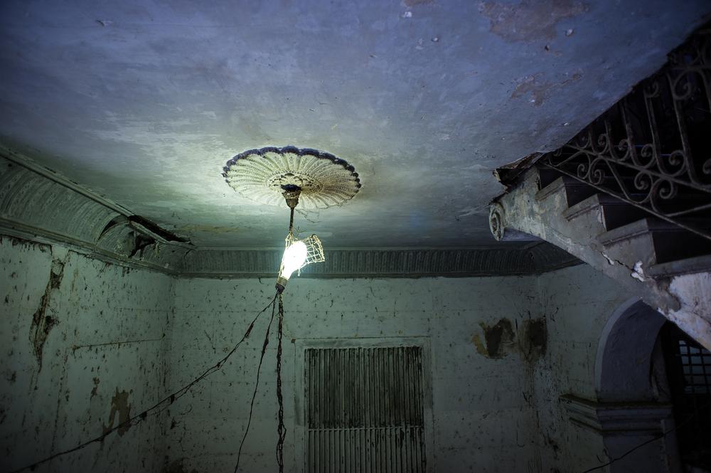 <p>A crumbling ceiling and staircase in Old Havana.</p>
