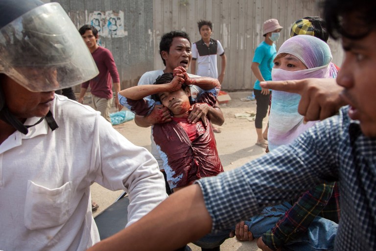 A crackdown on the garment workers' strike killed at least four and injured dozens more [AFP]