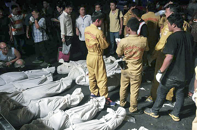 The bus was carrying Thai local government workers on a field trip to Laos [AP]