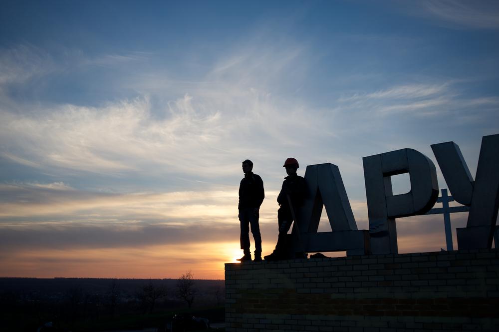 <p>Pro-Russia activists stand guard at a newly built checkpoint outside Druzhkivka, a city in the eastern Donetsk region. In the past couple of weeks, several cities and villages in the eastern region of Ukraine have been taken under control by separatist armed groups who reject the newly appointed government in Kiev.</p>