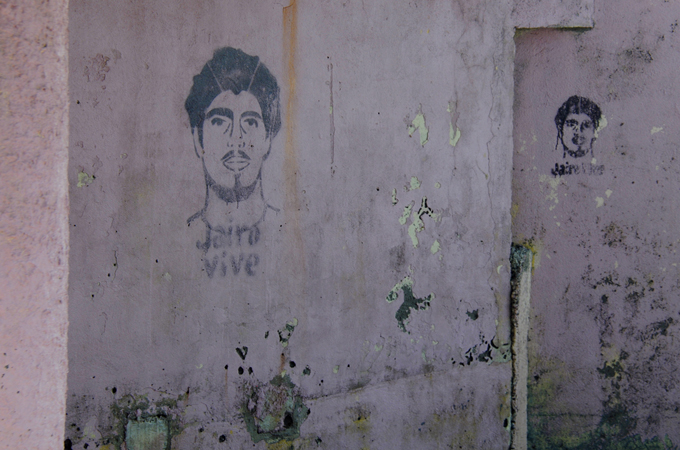 Stencils of murdered conservationist Jairo Mora are painted on walls in the city of Limon [Lindsay Fendt/Al Jazeera]