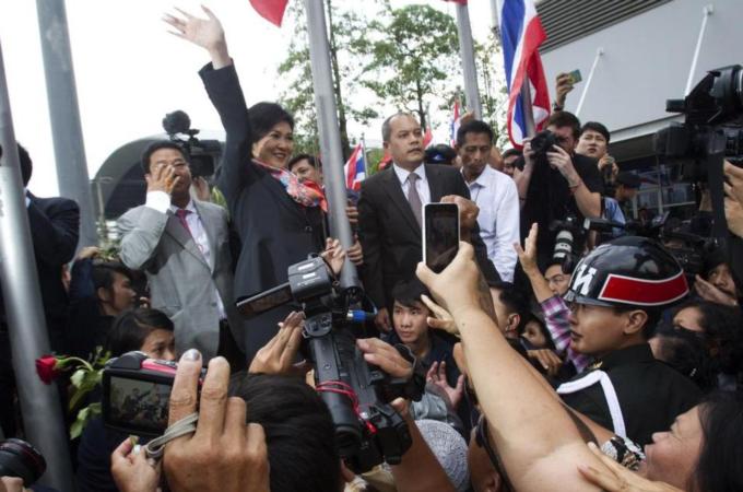 Thailand's Prime Minister Yingluck Shinawatra was ordered by a court to step down in a divisive ruling that handed a victory to anti-government protesters [AP]