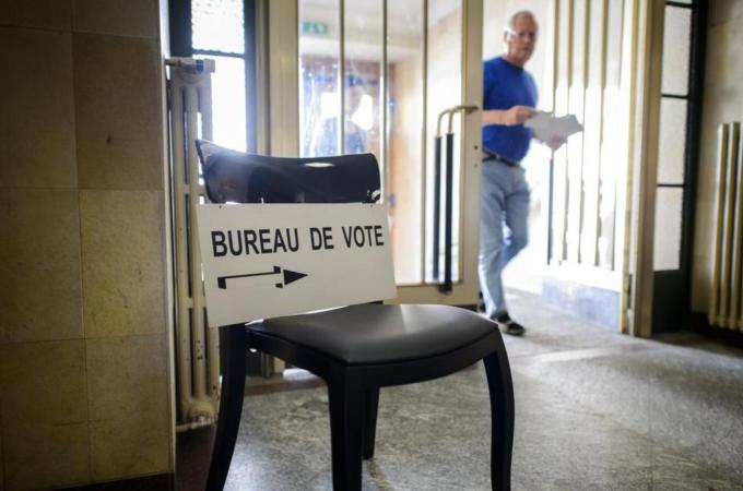 A man arrives to cast his ballot during a referendum in Switzerland [AFP]