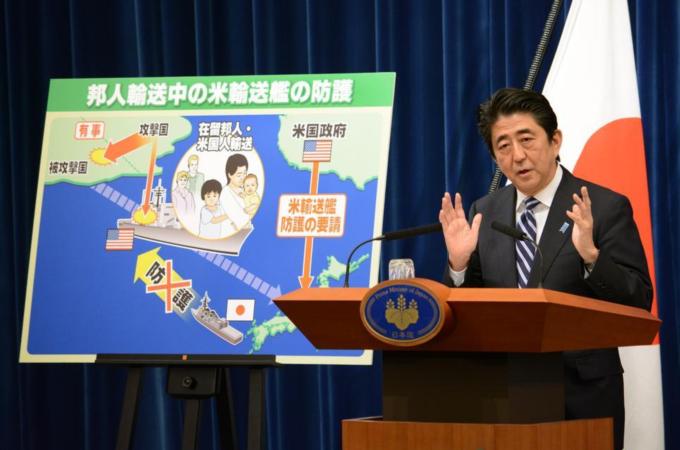 PM Shinzo Abe aims to beef up rules of military engagement to allow the Self-Defence Force to use force overseas [AFP]