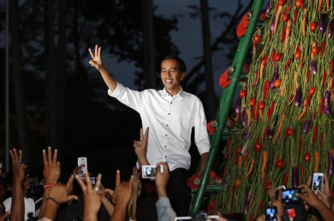 As governor of Jakarta, Joko Widodo introduced a Smart Card which helped 300,000 students from poor families [Reuters]