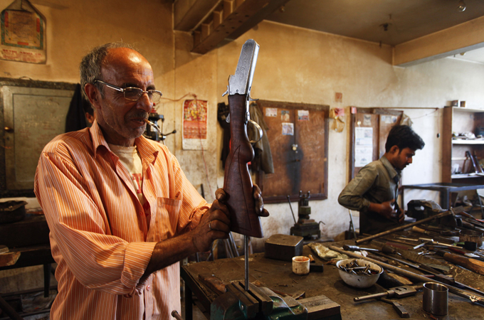 Mohammad Amin, one of the last gunsmiths, says the craft is gasping for breath [Wasim Khalid/Al Jazeera]