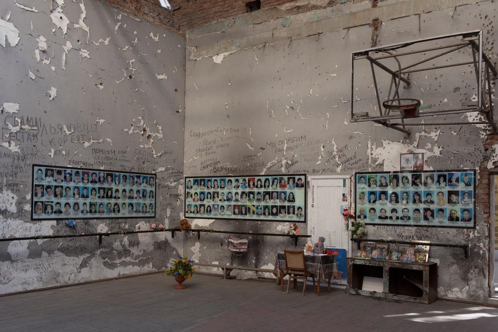 The hostages spent three days at the school's gymnasium in oppressive heat and without water. Today, that gym has become a grim memorial to the dead. [Andrei Kovalenko/Al Jazeera]