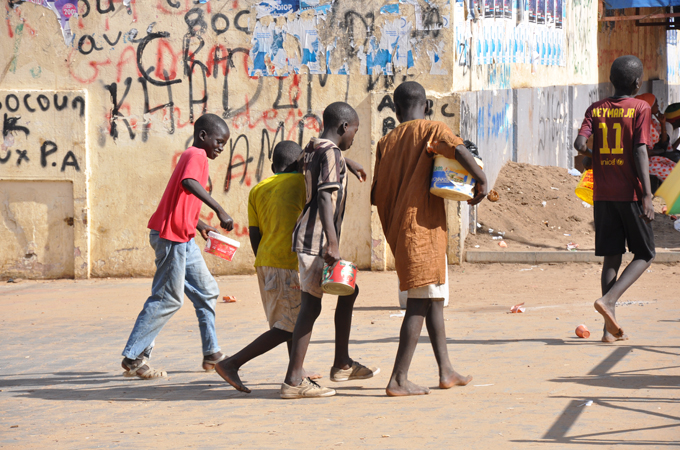 Dakar child beggars travel hundreds of kilometres from home [Assane Gueye/Al Jazeera]