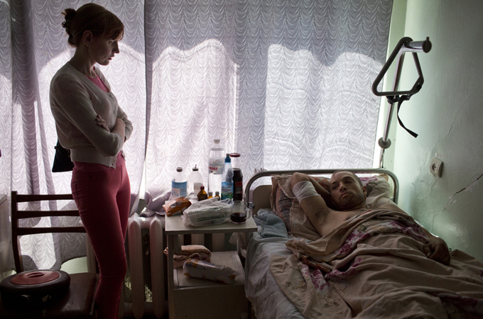 Ivan Balokha was wounded and his wife killed in shelling, just before the ceasefire [John Wendle/Al Jazeera]