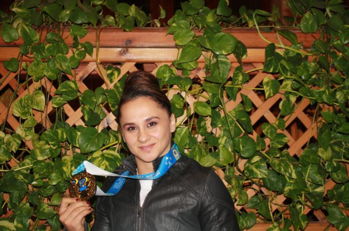 Begaj became the first female weightlifter from the country to win gold [Rozafa Kelmendi/Al Jazeera]