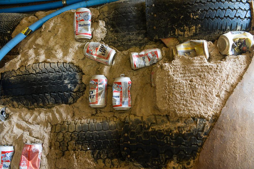 The walls of an 'Earthship' are made up of tyres, pounded with mud, and other recycled materials such as aluminium cans and beer bottles.