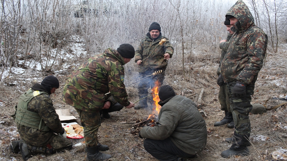 Soldiers on the road into Debaltseve, just after the ceasefire took effect [John Wendle/Al Jazeera] 