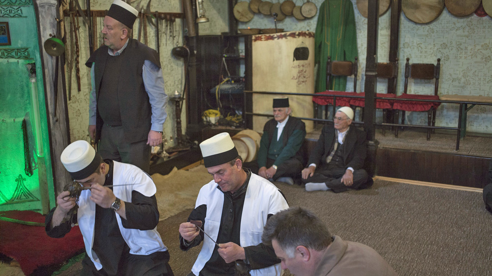 Sufi mystics from Prizren clean the zarfs [Ferdi Limani/Al Jazeera]