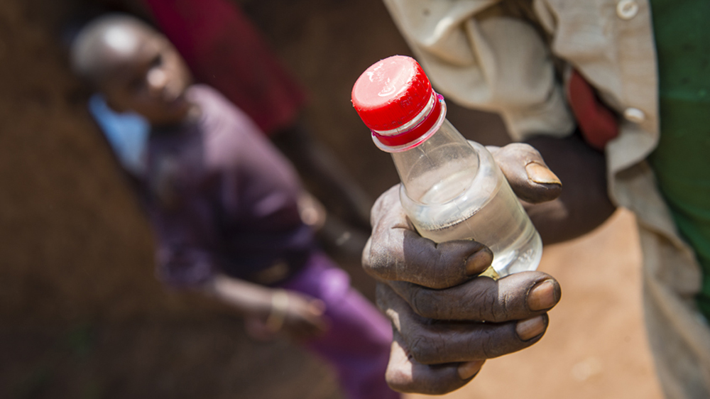The minimum drinking age in Uganda is 18, but this is rarely enforced. The sale of small plastic sachets and bottles make alcohol easily available [AJ Heath/Al Jazeera] 