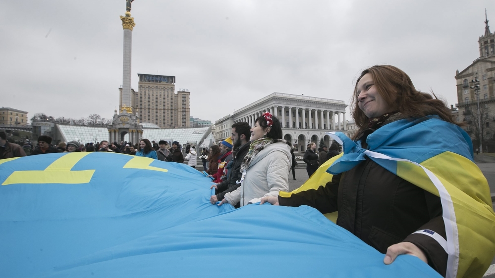 Crimean Tatars mark a first anniversary of annexation of Crimea by Russia in Kiev.