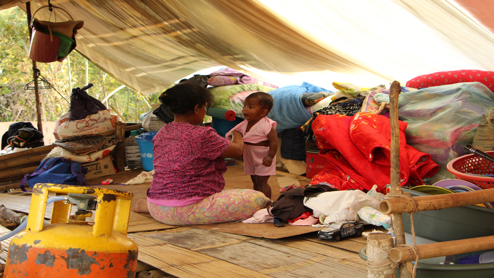 Many victims of the devastating floods still live in temporary shelters provided by aid organisations [Jarni Blakkarly/Al Jazeera]