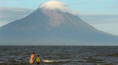 A family takes a swim in Lake Nicaragua. Once built, the transoceanic canal will run through the lake [Lindsay Fendt/Al Jazeera]  