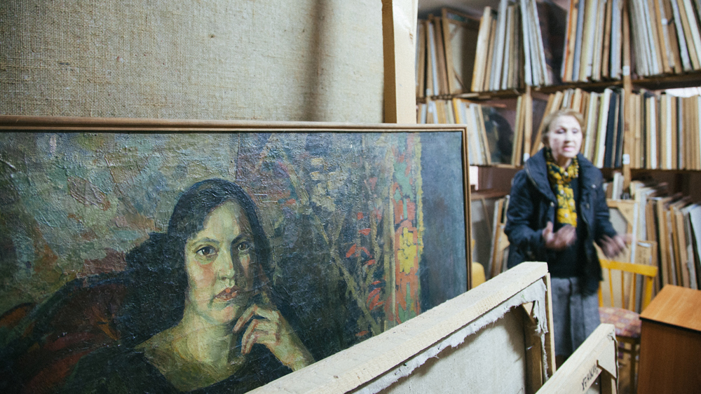 Valentina Sycheva, the Savitsky museum’s chief curator, shows the museum’s depository [Timur Karpov/Al Jazeera]