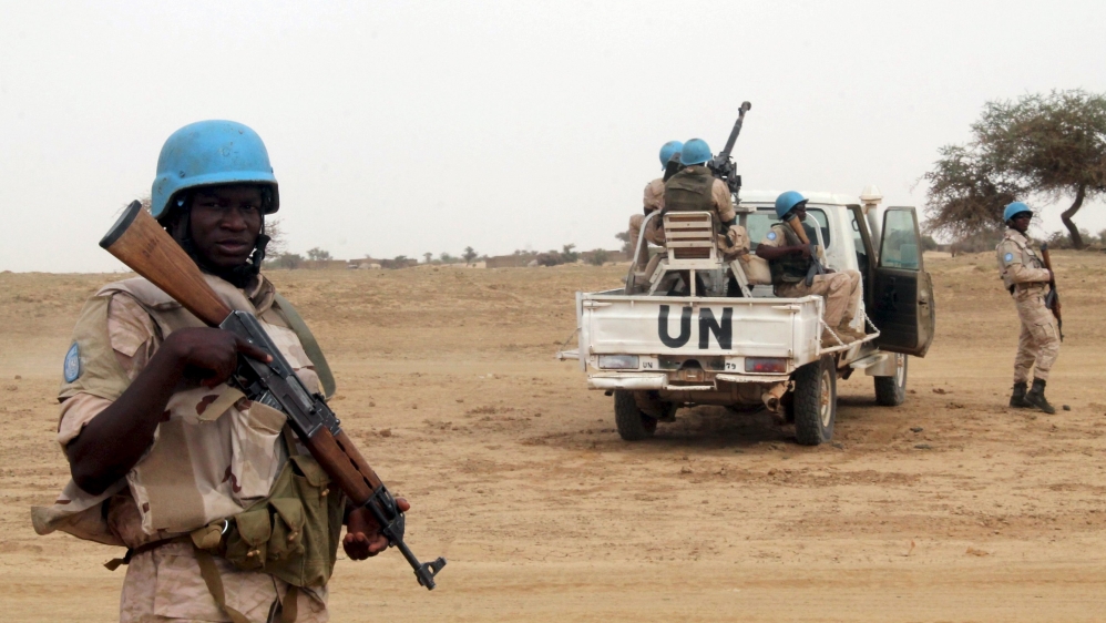 UN peacekeepers stand guard in the northern town of Kouroume