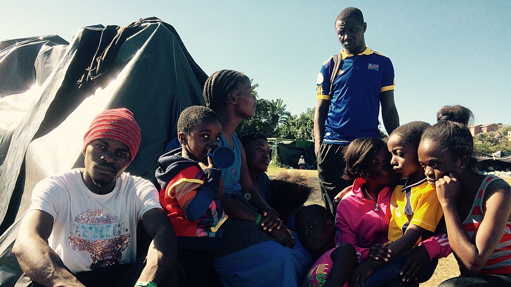Migrants said they were afraid to stay in South Africa but that they were also afraid to return to their home countries [Charles Stratford/Al Jazeera]