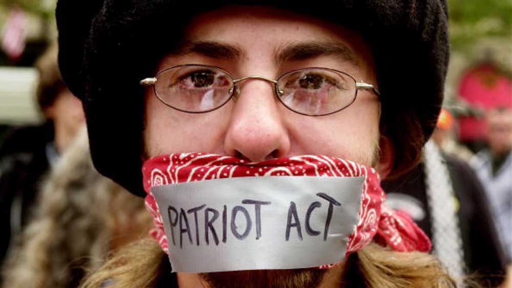 A man protests the Patriot Act during an anarchist rally on the final day of the Democratic National Convention at Copley Plaza in 2004 [Getty]