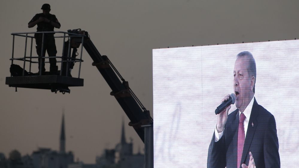 A Turkish security officer secures the area on an elevated platform as Turkey''s President Recep Tayyip Erdogan delivers his speech in Istanbul [AP]