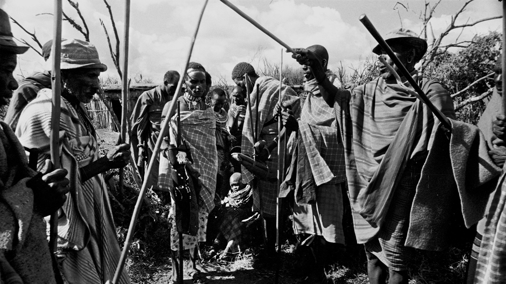 Weakened by the loss of blood, Juliana is unable to walk through the arch formed by village elders during her wedding ceremony [Mariella Furrer]