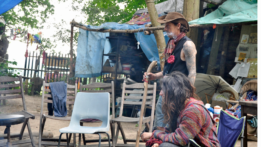 A natural spring provides water while many residents collect food discarded by nearby supermarkets [Simon Hooper/Al Jazeera]
