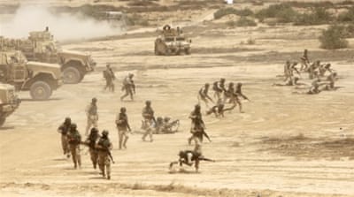 Iraqi soldiers take part in a training exercise in Baghdad [AFP]