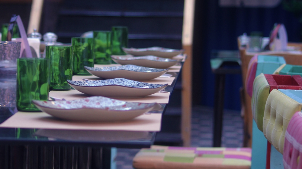 Junkyard uses old car parts for décor, old jars for dinnerware and recycles its oil for fuel [Al Jazeera]