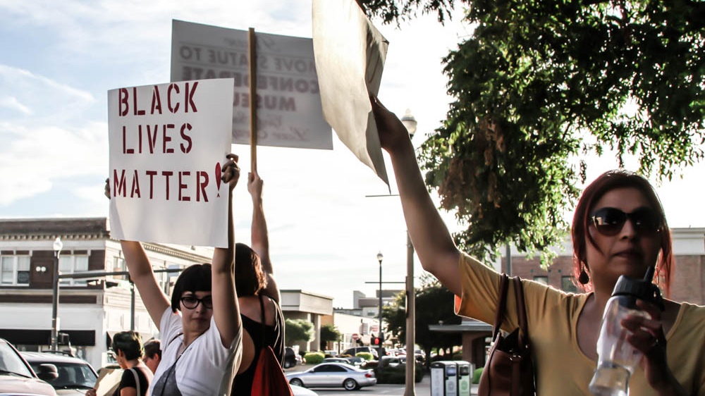 Many of the protesters expressed solidarity with the growing Black Lives Matter movement [  Shaghayegh Tajvidi  /Al Jazeera]